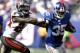 EAST RUTHERFORD, NJ - SEPTEMBER 16: Andre Brown #35 of the New York Giants holds off Mark Barron #24 of the Tampa Bay Buccaneers during a game at MetLife Stadium on September 16, 2012 in East Rutherford, New Jersey. (Photo by Jeff Zelevansky/Getty Images)