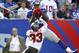 EAST RUTHERFORD, NJ - SEPTEMBER 16: Martellus Bennett #85 of the New York Giants pulls in a pass for a touchdown with coverage by Brandon McDonald #33 of the Tampa Bay Buccaneers during a game at MetLife Stadium on September 16, 2012 in East Rutherford, New Jersey. (Photo by Jeff Zelevansky/Getty Images)