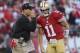 SAN FRANCISCO, CA - SEPTEMBER 16: Head coach Jim Harbaugh of the San Francisco 49ers gives his quarterback Alex Smith a play to run in the second quarter against the Detroit Lions at Candlestick Park on September 16, 2012 in San Francisco, California. (Photo by Thearon W. Henderson/Getty Images)