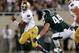 EAST LANSING, MI - SEPTEMBER 15: Everett Golson #5 of the Notre Dame Fighting Irish runs from the tackle of Marcus Rush #44 of the Michigan State Spartans during the first quarter at Spartan Stadium on September 15, 2012 in East Lansing, Michigan. (Photo by Gregory Shamus/Getty Images)