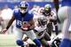 EAST RUTHERFORD, NJ - SEPTEMBER 16: Victor Cruz #80 of the New York Giants runs against the Tampa Bay Buccaneers during a game at MetLife Stadium on September 16, 2012 in East Rutherford, New Jersey. (Photo by Jeff Zelevansky/Getty Images)