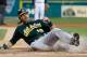 DETROIT, MI - SEPTEMBER 18: Josh Reddick #16 of the Oakland Athletics slides across home plate to score a first inning run while playing the Detroit Tigers at Comerica Park on September 18, 2012 in Detroit, Michigan. (Photo by Gregory Shamus/Getty Images)