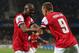 MONTPELLIER, FRANCE - SEPTEMBER 18: Abou Diaby of Arsenal congratulates Lukas Podolski of Arsenal celebrates scoring his teams first goal during the UEFA Champions League match between Montpellier Herault SC and Arsenal at Stade de la Mosson on September 18, 2012 in Montpellier, France. (Photo by Julian Finney/Getty Images)