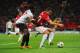 MANCHESTER, ENGLAND - SEPTEMBER 19: Robin van Persie of Manchester United shields the ball from Emmanuel Eboue of Galatasaray during the UEFA Champions League Group H match between Manchester United and Galatasaray at Old Trafford on September 19, 2012 in Manchester, England. (Photo by Michael Regan/Getty Images)