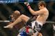 September 22, 2012; Toronto, ON, CANADA; Jimy Hettes (right) kicks Marcus Brimage in the featherweight fight during UFC 152 at the Air Canada Centre. Mandatory Credit: Tom Szczerbowski-US PRESSWIRE