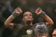 September 22, 2012; Toronto, ON, CANADA; Demetrious Johnson celebrates his win over Joseph Benavidez (not pictured) in the flyweight championship during UFC 152 at the Air Canada Centre. Mandatory Credit: Tom Szczerbowski-US PRESSWIRE