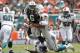 MIAMI GARDENS, FL - SEPTEMBER 23: Jared Odrick #98 of the Miami Dolphins hits Mark Sanchez #6 of the New York Jets as he gets the ball away on September 23, 2012 at Sun Life Stadium in Miami Gardens, Florida. (Photo by Joel Auerbach/Getty Images)