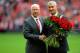 LIVERPOOL, ENGLAND - SEPTEMBER 23: Sir Bobby Charlton presents Ian Rush with flowers before the Barclays Premier League match between Liverpool and Manchester United at Anfield on September 23, 2012 in Liverpool, England. (Photo by Michael Regan/Getty Images)