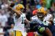 SEATTLE, WA - SEPTEMBER 24: Quarterback Aaron Rodgers #12 of the Green Bay Packers throws a pass in the first half against the Seattle Seahawks at Qwest Field on September 24, 2012 in Seattle, Washington. (Photo by Otto Greule Jr/Getty Images)