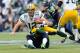 Sep 24, 2012; Seattle, WA, USA; Green Bay Packers quarterback Aaron Rodgers (12) is sacked by Seattle Seahawks defensive end Bruce Irvin (51) during the 1st half at CenturyLink Field. Mandatory Credit: Steven Bisig-US PRESSWIRE