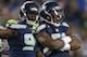 SEATTLE, WA - AUGUST 30: Defensive end Bruce Irvin #51 of the Seattle Seahawks is congratulated by Jaye Howard #94 after pressuring quarterback Terrelle Pryor of the Oakland Raiders at CenturyLink Field on August 30, 2012 in Seattle, Washington. The Seahawks defeated the Raiders 21-3. (Photo by Otto Greule Jr/Getty Images)