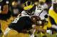 SOUTH BEND, IN - SEPTEMBER 22: Quarterback Denard Robinson #16 of the Michigan Wolverines is tackled by cornerback Bennett Jackson #2 of the Notre Dame Fighting Irish in the third quarter at Notre Dame Stadium on September 22, 2012 in South Bend, Indiana. (Photo by Jonathan Daniel/Getty Images)