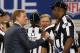 ARLINGTON, TX - FEBRUARY 06: Roger Goodell, the commisioner of the NFL, talks with umpire Chad Brown #31 before the Pittsburgh Steelers take on the Green Bay Packers in Super Bowl XLV at Cowboys Stadium on February 6, 2011 in Arlington, Texas. (Photo by Doug Pensinger/Getty Images)