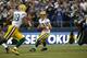 SEATTLE, WA - SEPTEMBER 24: Quarterback Aaron Rodgers #12 of the Green Bay Packers looks downfield against the Seattle Seahawks at CenturyLink Field on September 24, 2012 in Seattle, Washington. (Photo by Otto Greule Jr/Getty Images)