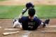MILWAUKEE, WI - AUGUST 16: Norichka Aoki #29 of the Milwaukee Brewers lies on the ground after striking out against the Philadelphia Phillies during their game at Miller Park onAugust 16, 2012 in Milwaukee, Wisconsin. (Photo by Mark Hirsch/Getty Images)