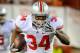 LINCOLN, NE - OCTOBER 8: Running back Carlos Hyde #34 of the Ohio State Buckeyes runs past linebacker Lavonte David #4 of the Nebraska Cornhuskers during their game at Memorial Stadium October 8, 2011 in Lincoln, Nebraska. Nebraska Defeated Ohio State 34-27. (Photo by Eric Francis/Getty Images)