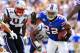 Sep 25, 2011; Orchard Park, NY, USA; Buffalo Bills running back Fred Jackson (22) runs with the ball as New England Patriots defensive end Shaun Ellis (94) pursues during the third quarter at Ralph Wilson Stadium. Mandatory Credit: Kevin Hoffman-US PRESSWIRE