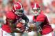 TUSCALOOSA, AL - SEPTEMBER 22: Quarterback AJ McCarron #10 of the Alabama Crimson Tide hands the ball off to running back Eddie Lacy #42 while playing against the Florida Atlantic Owls on September 22, 2012 at Bryant-Denny Stadium in Tuscaloosa, Alabama. Alabama defeated Florida Atlantic 40-7. (Photo by Michael Chang/Getty Images)