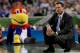 NEW ORLEANS, LA - MARCH 31: Head coach Bill Self of the Kansas Jayhawks reacts in the first half as the Jayhawks mascot looks over at him as the Jayhawks take on the Ohio State Buckeyes during the National Semifinal game of the 2012 NCAA Division I Men's Basketball Championship at the Mercedes-Benz Superdome on March 31, 2012 in New Orleans, Louisiana. (Photo by Chris Graythen/Getty Images)