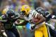 SEATTLE, WA - SEPTEMBER 24: Ben Obomanu #87 and Jeremy Lane #37 of the Seattle Seahawks chase down and tackle Randall Cobb #18 of the Green Bay Packers during first half action on September 24, 2012 in Seattle, Washington. (Photo by Kevin Casey/Getty Images)