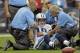 HOUSTON, TX - SEPTEMBER 30: Jake Locker #10 of the Tennessee Titans is helped up by Tennessee Titans medical staff after he took a hard hit from Glover Quin #29 of the Houston Texans at Reliant Arena at Reliant Park on September 30, 2012 in Houston, Texas. (Photo by Bob Levey/Getty Images)