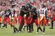 LANDOVER, MD - SEPTEMBER 29: Defensive back Arryn Chenault #25 of the Cincinnati Bearcats celebrates with teammates after his goal-line interception during the second quarter of their NCAA football game against the Virginia Tech Hokies at FedExField on September 29, 2012 in Landover, Maryland. (Photo by Jonathan Ernst/Getty Images)