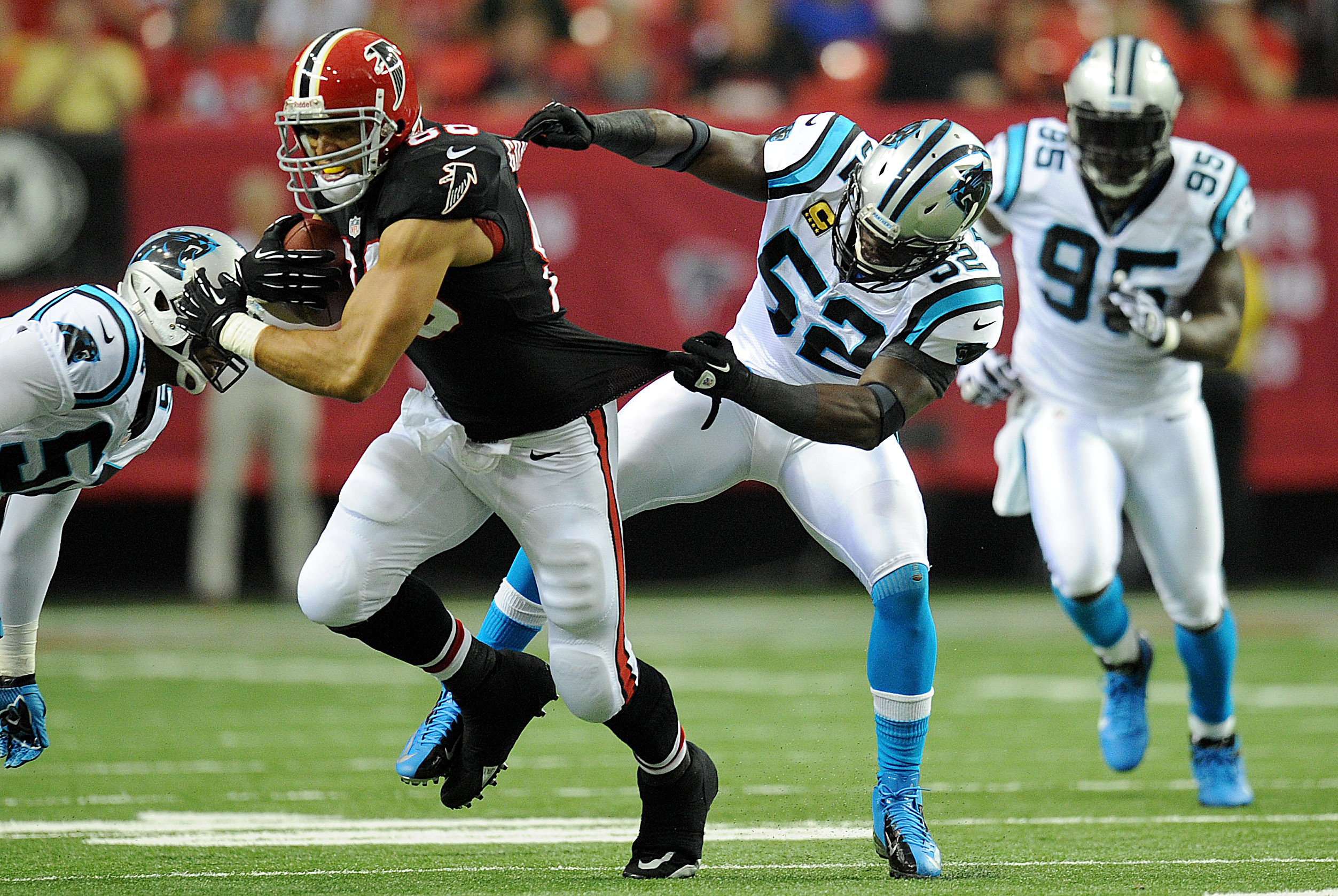 Carolina Panthers' Jon Beason, right, and Dan Morgan, left, work