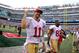 Sept 30, 2012; East Rutherford, NJ, USA; San Francisco 49ers quarterback Alex Smith (11) runs off the field after their game against the New York Jets at MetLIfe Stadium. The 49ers defeated the Jets 34-0. Mandatory Credit: Ed Mulholland-US PRESSWIRE