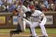 ARLINGTON, TX - AUGUST 21: Adam Jones #10 of the Baltimore Orioles beats the tad by Mitch Moreland #18 of the Texas Rangers at Rangers Ballpark in Arlington on August 21, 2012 in Arlington, Texas. (Photo by Rick Yeatts/Getty Images)