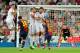 MADRID, SPAIN - AUGUST 29: Leo Messi of FC Barcelona strikes a penalty while Cristiano Ronaldo, Gonzalo Higuain and Xabi Alonso of Real Madrid attempt to block during the Supercopa second leg match between Real Madrid and Barcelona at Estadio Santiago Bernabeu on August 29, 2012 in Madrid, Spain. (Photo by Gonzalo Arroyo Moreno/Getty Images)
