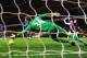 LONDON, ENGLAND - JANUARY 22: Robin van Persie of Arsenal (2R) shoots past Anders Lindegaard of Manchester United to score their first goal during the Barclays Premier League match between Arsenal and Manchester United at Emirates Stadium on January 22, 2012 in London, England. (Photo by Mike Hewitt/Getty Images)