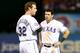 Ian Kinsler tries to console Hamilton after his eighth inning-strikeout Friday night.
