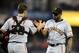 September 28, 2012; San Diego, CA, USA; San Francisco Giants relief pitcher Santiago Casilla (46) and catcher Buster Posey (28) celebrate after a 3-1 win against the San Diego Padres at Petco Park. Mandatory Credit: Christopher Hanewinckel-US PRESSWIRE