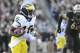 Oct 06, 2012; West Lafayette, IN, USA; Michigan Wolverines quarterback Denard Robinson (16) rushes the ball against the Purdue Boilermakers during the second quarter at Ross Ade Stadium. Mandatory Credit: Mike DiNovo-US PRESSWIRE
