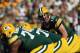 GREEN BAY, WI - SEPTEMBER 30: Quarterback Aaron Rodgers #12 of the Green Bay Packers prepares to run a play against the New Orleans Saints at Lambeau Field on September 30, 2012 in Green Bay, Wisconsin. (Photo by Jeff Gross/Getty Images)