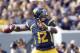 MORGANTOWN, WV - SEPTEMBER 29: Geno Smith #12 of the West Virginia Mountaineers drops back to pass against the Baylor Bears during the game on September 29, 2012 at Mountaineer Field in Morgantown, West Virginia. (Photo by Justin K. Aller/Getty Images)