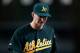 DETROIT, MI - OCTOBER 06: Jarrod Parker #11 of the Oakland Athletics walks towards the dugout after he was taken out of the game in the bottom of the seventh inning against the Detroit Tigers during Game One of the American League Division Series at Comerica Park on October 6, 2012 in Detroit, Michigan. (Photo by Gregory Shamus/Getty Images)