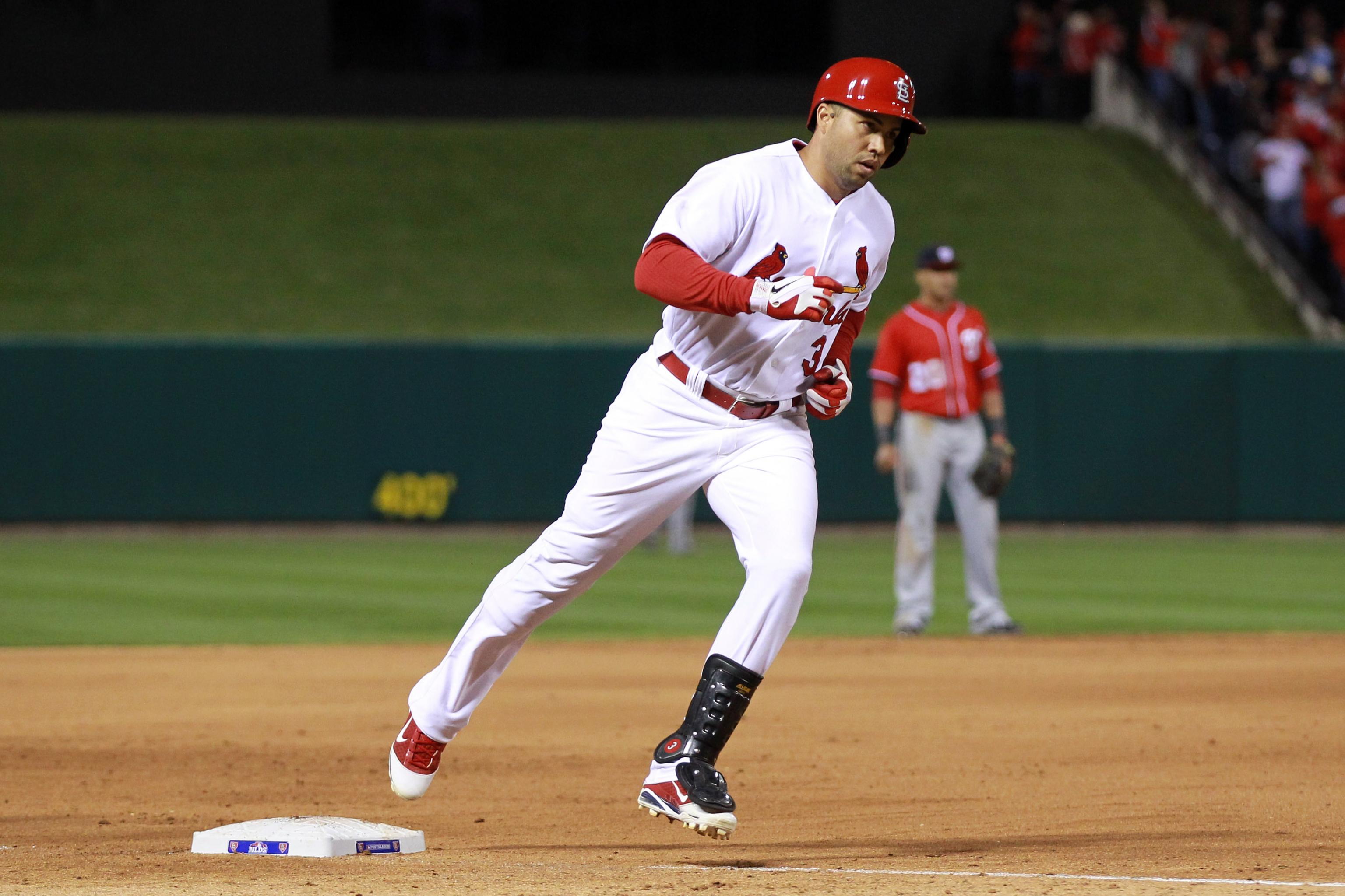 St. Louis Cardinals' Carlos Beltran straps on his batting gloves