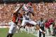 DALLAS, TX - OCTOBER 8: Kenny Stills #4 of the Oklahoma Sooners catches a touchdown pass over Adrian Phillips #17 of the Texas Longhorns at the Cotton Bowl on October 8, 2011 in Dallas, Texas. The Sooners defeated the Longhorns 55 to 17. (Photo by Wesley Hitt/Getty Images)