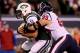 EAST RUTHERFORD, NJ - OCTOBER 08: Tim Tebow #15 of the New York Jets runs with the ball against J.J. Watt #99 of the Houston Texans in the second half at MetLife Stadium on October 8, 2012 in East Rutherford, New Jersey. (Photo by Alex Trautwig/Getty Images)