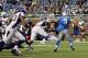 Sep 30, 2012; Detroit, MI, USA; Detroit Lions quarterback Matthew Stafford (9) throws an underhanded backhand pass during the fourth quarter against the Minnesota Vikings at Ford Field. Vikings defeat the Lions 20-13. Mandatory Credit: Raj Mehta-US PRESSWIRE