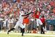 MIAMI GARDENS, FL - SEPTEMBER 29: Phillip Dorsett #4 of the Miami Hurricanes catches the ball for a touchdown past David Amerson #1 of the North Carolina State Wolfpack on September 29, 2012 at Sun Life Stadium in Miami Gardens, Florida. (Photo by Joel Auerbach/Getty Images)