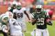 Sept 23, 2012; Miami, FL, USA; New York Jets running back Bilal Powell (29) runs past Miami Dolphins middle linebacker Karlos Dansby (58) during The second half at Sun Life Stadium. The Jets won 23-20 in overtime. Mandatory Credit: Steve Mitchell-US PRESSWIRE