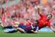 LIVERPOOL, ENGLAND - OCTOBER 07: Dean Whitehead of Stoke City tackles Luis Suarez of Liverpool during the Barclays Premier League match between Liverpool and Stoke City at Anfield on October 7, 2012 in Liverpool, England. (Photo by Clive Brunskill/Getty Images)