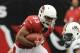 GLENDALE, AZ - SEPTEMBER 30: William Powell #33 of the Arizona Cardinals jumps over a tackle by Olivier Vernon #50 of the Miami Dolphins at University of Phoenix Stadium on September 30, 2012 in Glendale, Arizona. (Photo by Norm Hall/Getty Images)