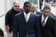 RICHMOND, VA - AUGUST 27: Atlanta Falcons quarterback Michael Vick (R) arrives at federal court with attorney Billy Martin (R) August 27, 2007 in Richmond, Viriginia. Vick pleaded guilty to a federal dogfighting charge. (Photo by Steve Helber-Pool/Getty Images)