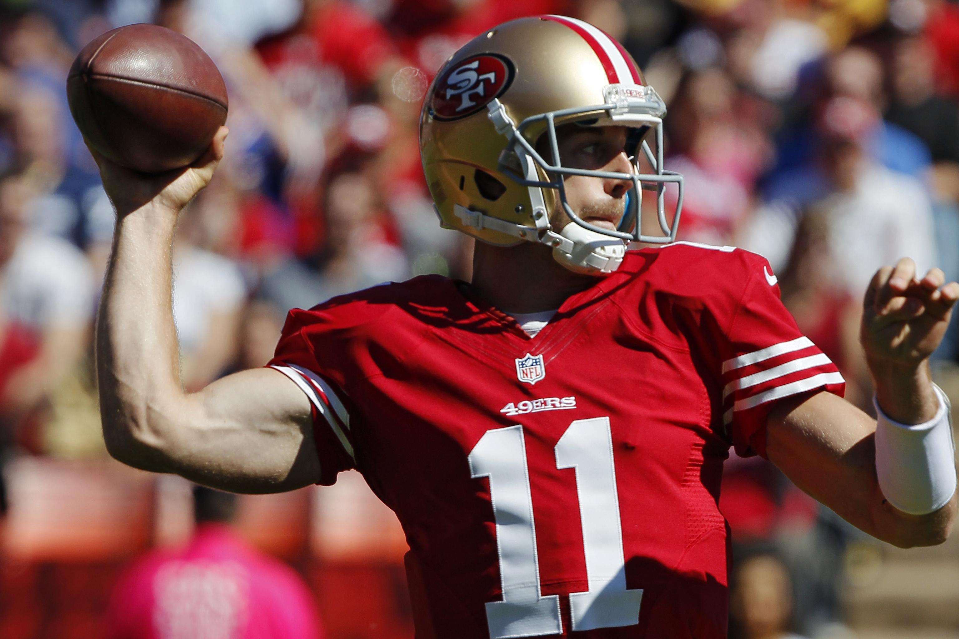 San Francisco 49ers rookie QB Alex Smith drops back to pass against the  Indianapolis Colts at Monster Park in San Francisco on October 9, 2005.  Smith was picked 4 times in his