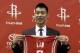 HOUSTON, TX - JULY 19: Jeremy Lin of the Houston Rockets displays his jersey during a press conference at Toyota Center on July 19, 2012 in Houston, Texas. (Photo by Bob Levey/Getty Images)
