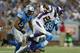 DETROIT, MI - SEPTEMBER 30: Adrian Peterson #28 of the Minnesota Vikings runs for a fshort gain as DeAndre Levy #54 and Erik Coleman #24 of the Detroit Lions attempt to make the stop during the game at Ford Field on September 30, 2012 in Detroit, Michigan. The Vikings defeated the Lions 20-13. (Photo by Leon Halip/Getty Images)