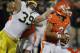 CHAMPAIGN, IL - NOVEMBER 12: Nathan Scheelhaase #2 of the Illinois Fighting Illini avoids the rush of Will Heininger #39 of the Michigan Wolverines at Memorial Stadium on November 12, 2011 in Champaign, Illinois. Michigan defeated Illinois 31-14. (Photo by Jonathan Daniel/Getty Images)